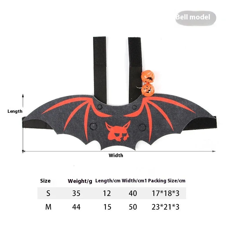 Black cat wearing an orange felt batwing Halloween costume with bell.