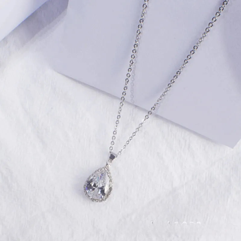 Pink rose gold drop shape rhinestone necklace with geometric design on alloy chain