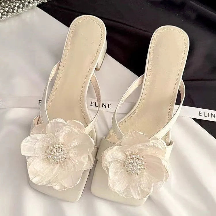 Women's cream white chunky heel sandals with square toe and single satin strap on a rubber sole.