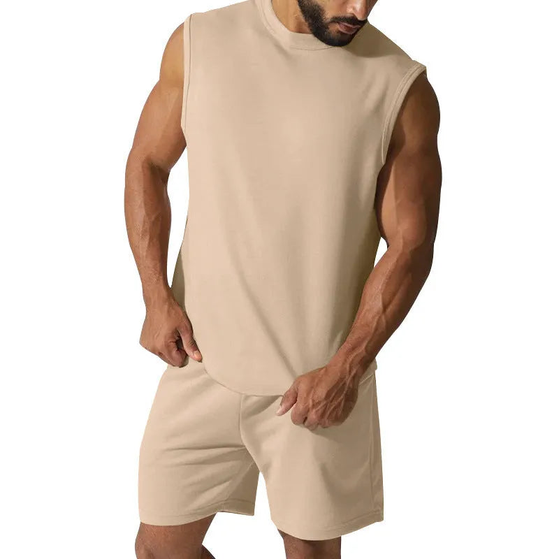 Men's sleeveless cotton blend sports top and matching shorts in a solid colour, laid flat.