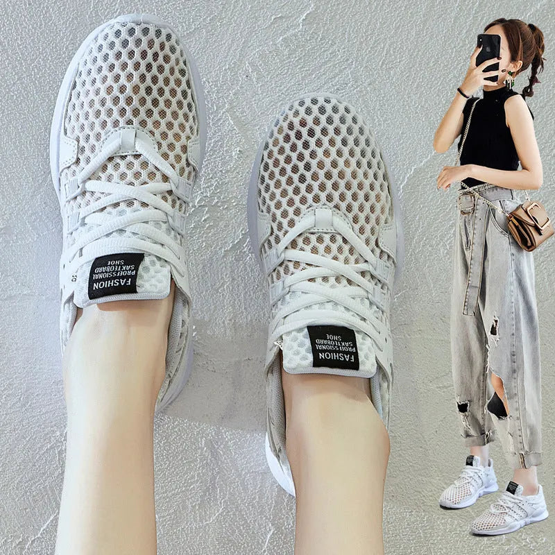 Women's low-top hollow mesh sneakers in white on a solid background.