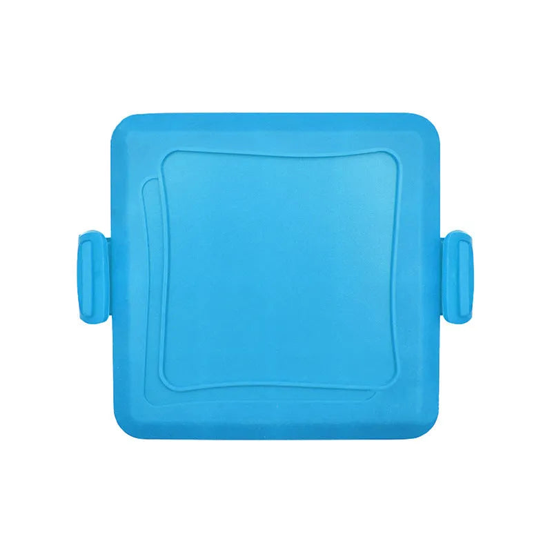 Red silicone baking tray with matching oven gloves set on kitchen counter