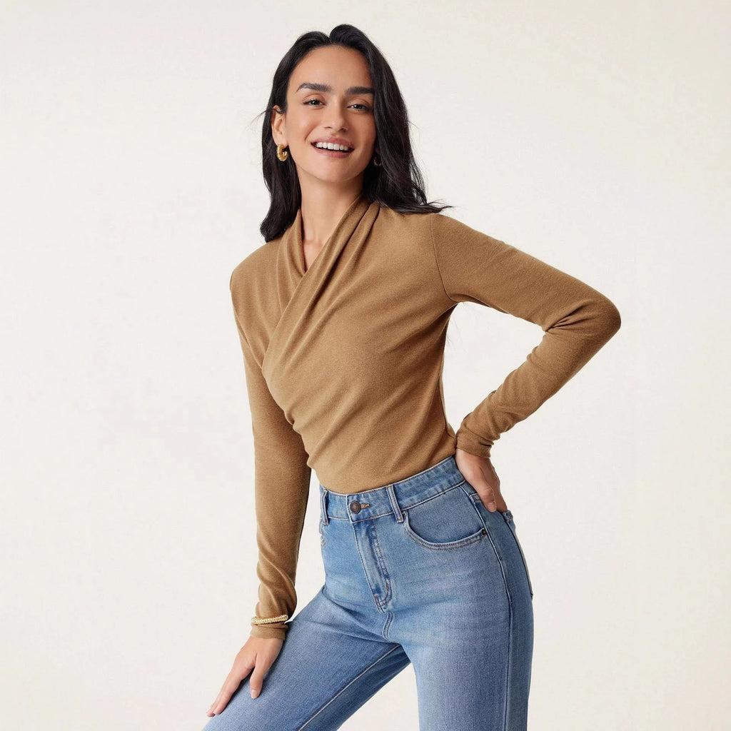 Camel-coloured women's slim fit pullover sweater with long sleeves on a hanger.