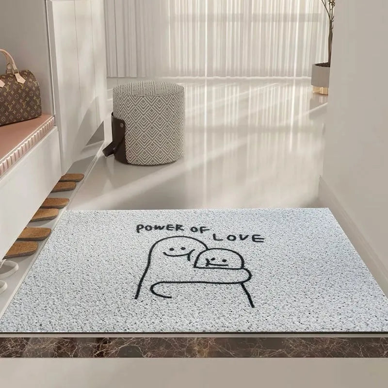 Square PVC floor mat with a large cartoon face Mr Big Nose design and geometric pattern on a grey background.