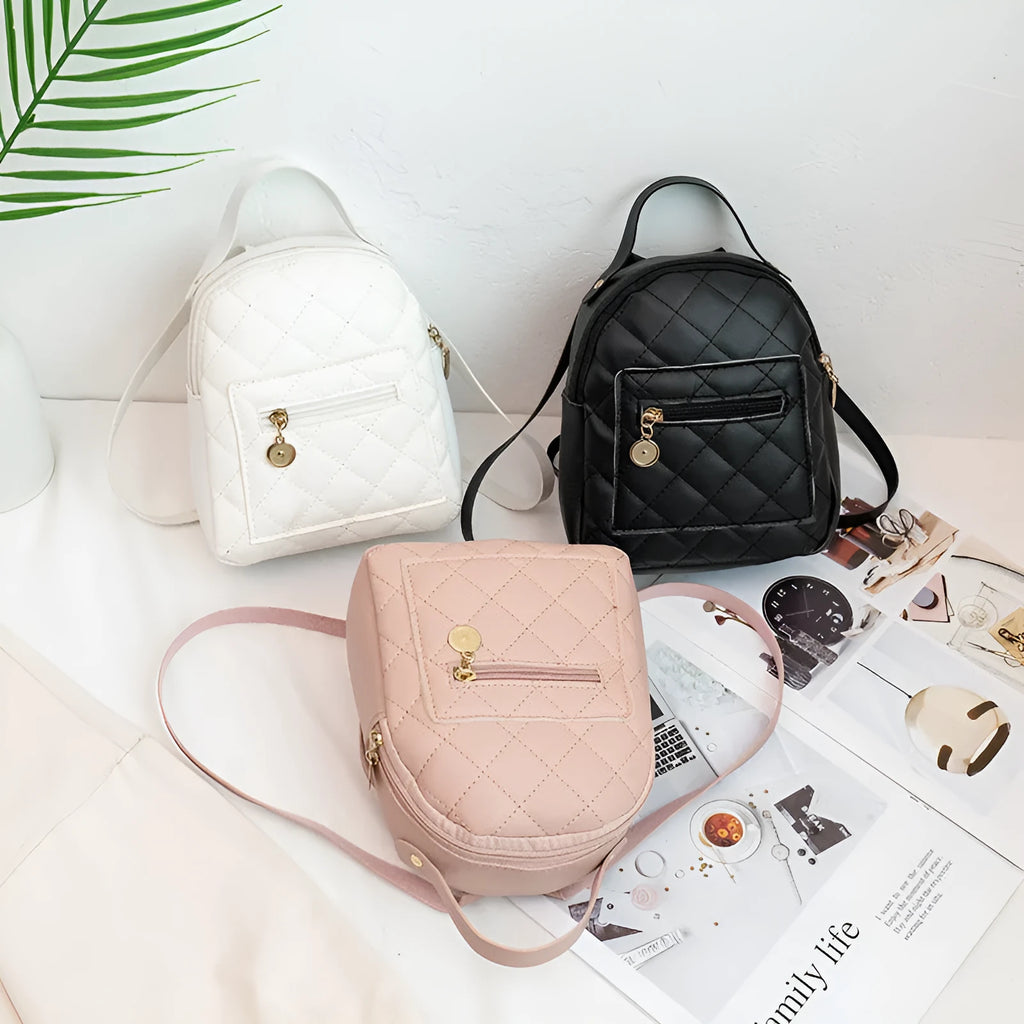 Hardback white PU girls backpack with embroidery, showing front sandwich pocket and soft carry handle.