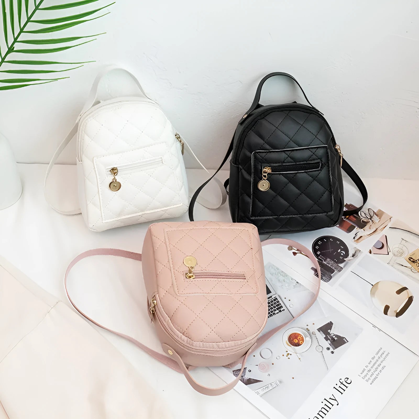 Hardback white PU girls backpack with embroidery, showing front sandwich pocket and soft carry handle.