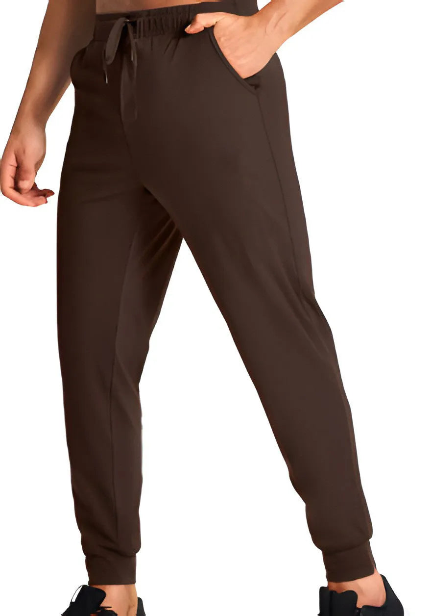 Men's loose fit solid colour casual trousers in polyester fabric on a hanger