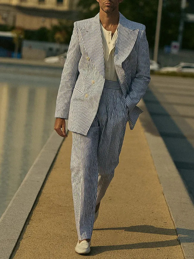 Blue and white striped polyester suit set with blazer and matching trousers