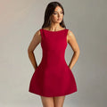 A slim-fitting, backless, sleeveless summer dress with a high waist and short skirt.
