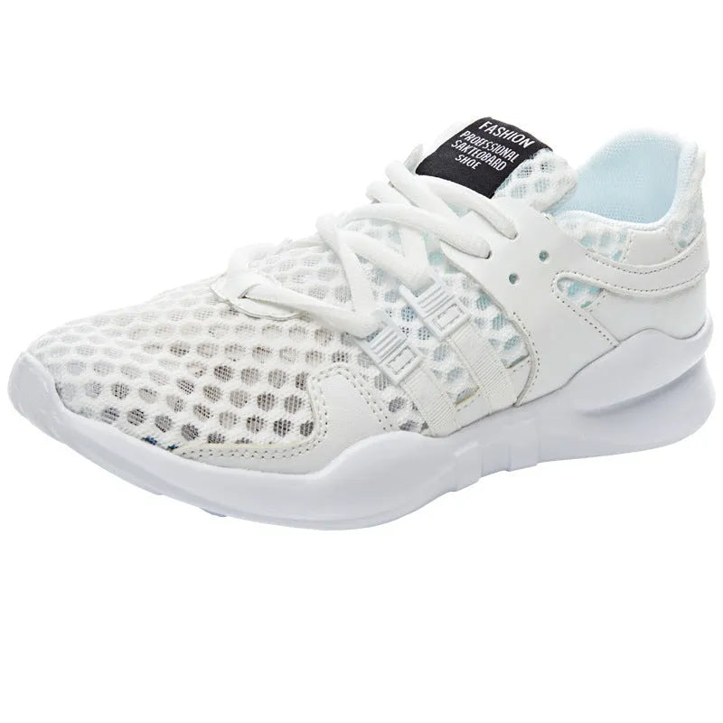 Women's low-top hollow mesh sneakers in white on a solid background.