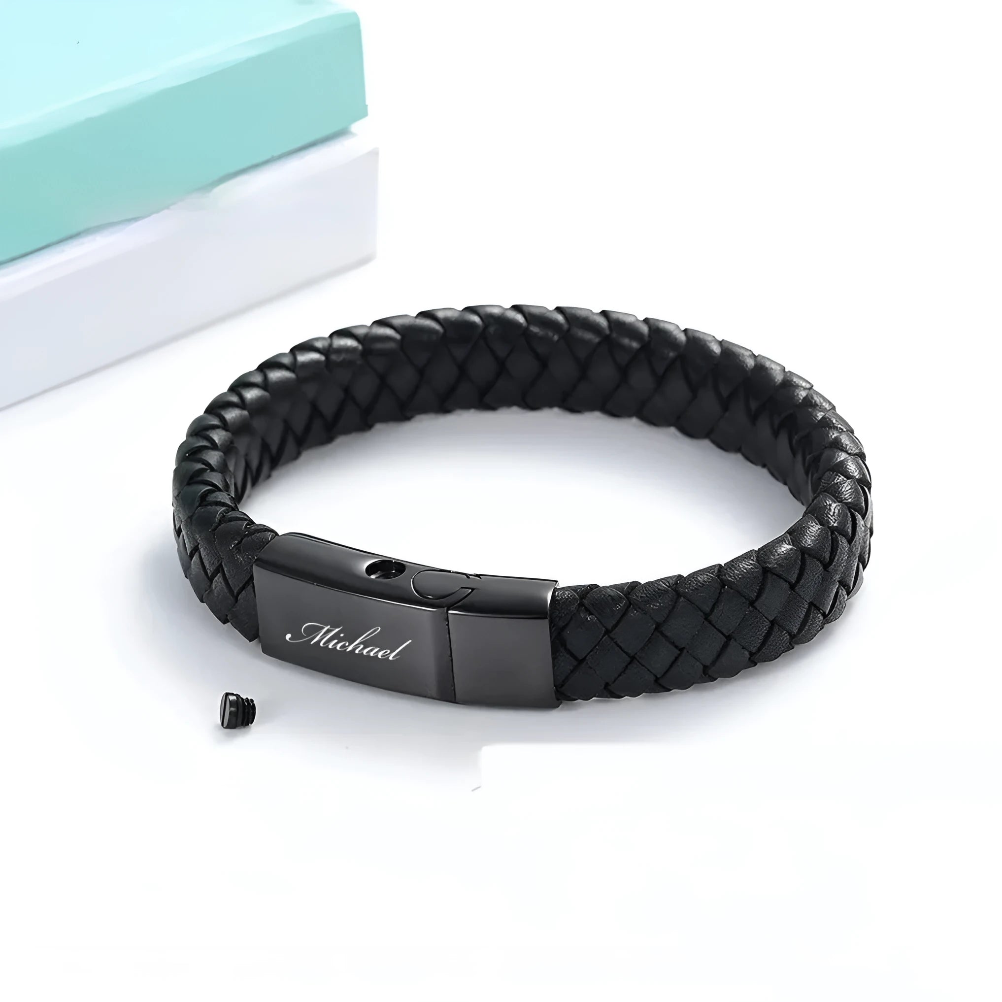 Black stainless steel and leather woven casket bracelet with English text, in a gift box.