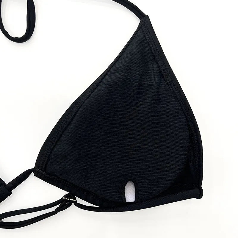 Black long sleeve women's bikini top and briefs, four-piece swimwear set.