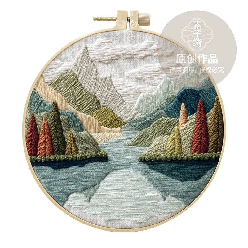 Embroidery DIY kit with landscape-printed cotton fabric, thread, needles, and a 15cm bamboo-style frame.