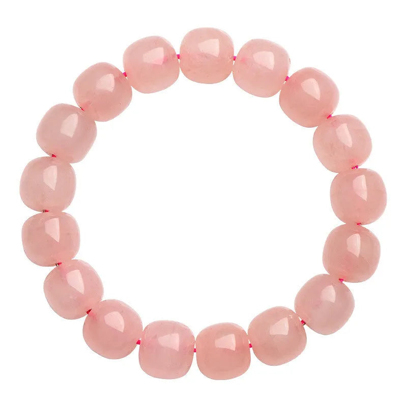 Pink natural crystal barrel bead bracelet with geometric shape on wrist