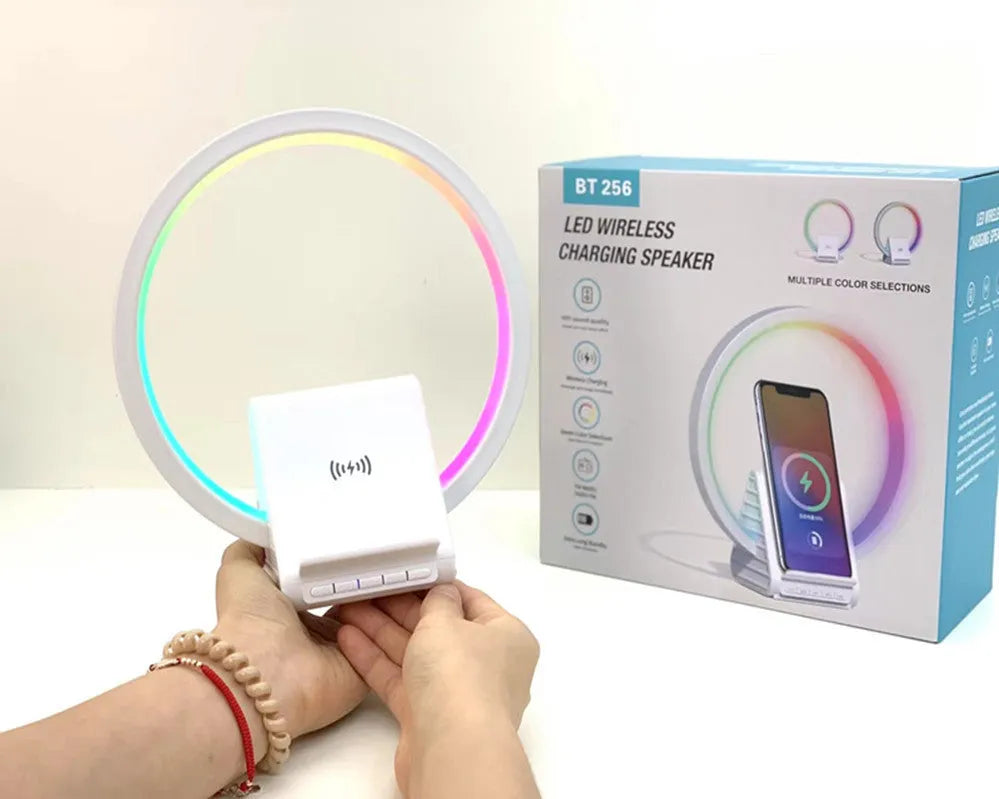 White smart Bluetooth speaker with LED ambience light and wireless charging surface