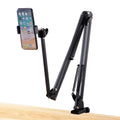 Black foldable metal cantilever bracket holding a tablet, showing its adjustable arms and clip.
