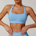 Women's halter neck sports bra in nylon with built-in pads and medium support