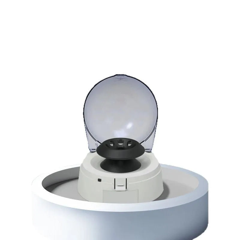 Mini white electric laboratory centrifuge unit on a benchtop