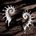 Matte finish conch stud earrings with exaggerated three-dimensional alloy design
