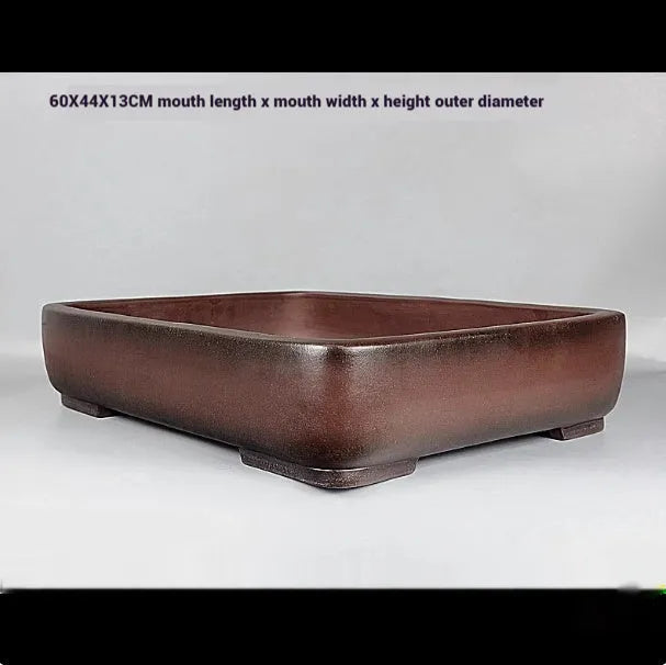 Handmade rectangular purple clay flower pot with antique finish showing natural colour variation