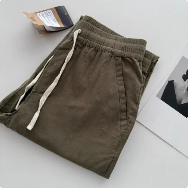 Men's loose straight leg casual trousers with drawstring waist in beige, black, green, grey, and navy blue colours