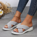 Women's black peep-toe wedge slippers with thick rubber sole showing fish mouth scaffold shape