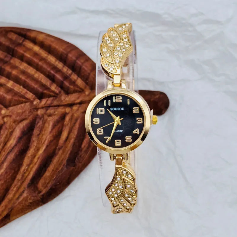Women's stainless steel watch with round gold surface dial and vachette clasp