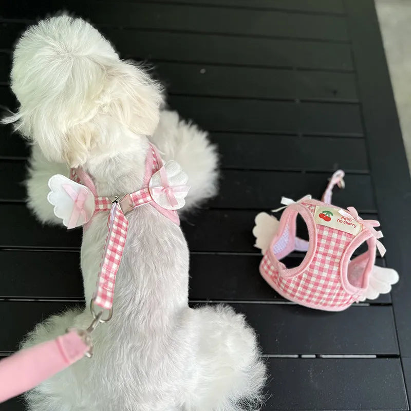 Small dog wearing pink cotton chest and back harness with adjustable straps