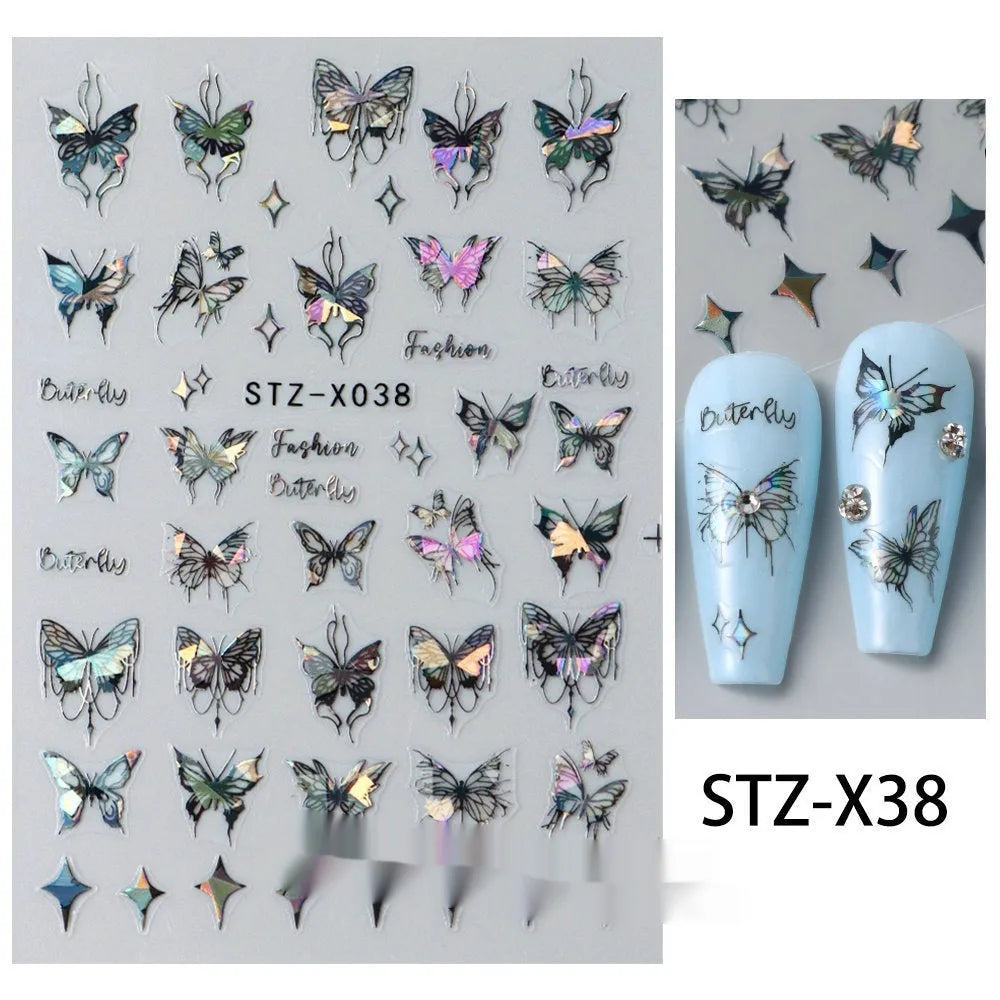 Pack of black and silver love heart cartoon nail art stickers on a plastic sheet.