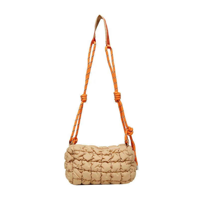 Women's soft nylon messenger bag in pillow shape with rhombus pattern and crossbody strap.