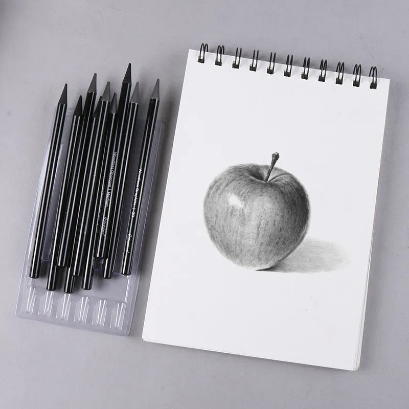 Set of nine wooden artist pencils including graphite and carbonized types on suction card packaging