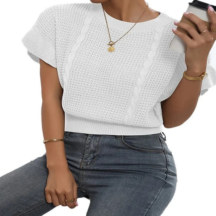 Knitted loose pullover sweater with ruffled short sleeves and a 3D twisted string pattern, shown in a neutral colour.