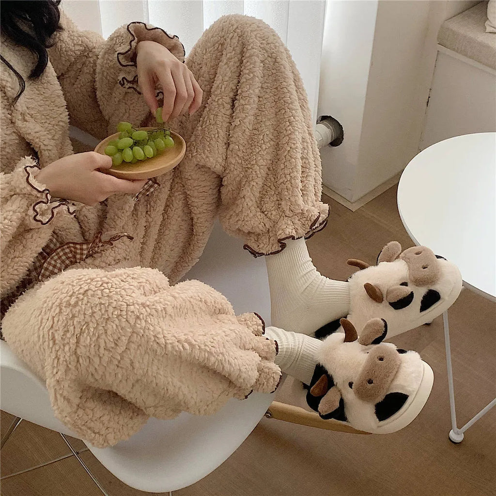White cow plush slippers for women with non-slip textured soles