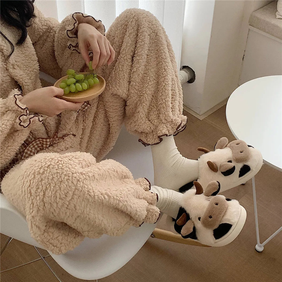 White cow plush slippers for women with non-slip textured soles