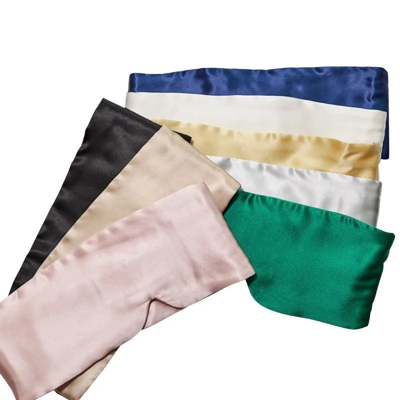 Mulberry silk sleep mask shown in one of seven colours: black, champagne gold, navy blue, silver grey, white, pink, or green.
