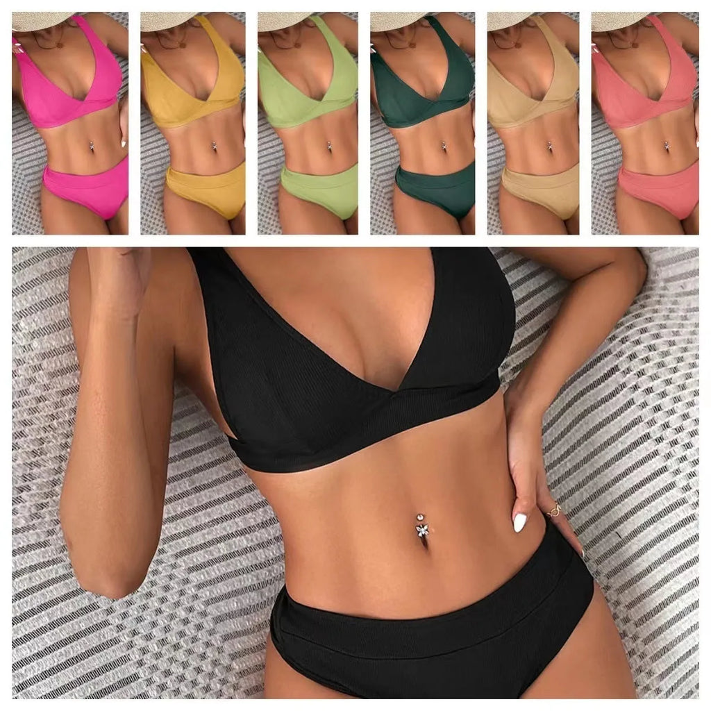 Women's black lace-up front bikini with high-leg split design on a mannequin.