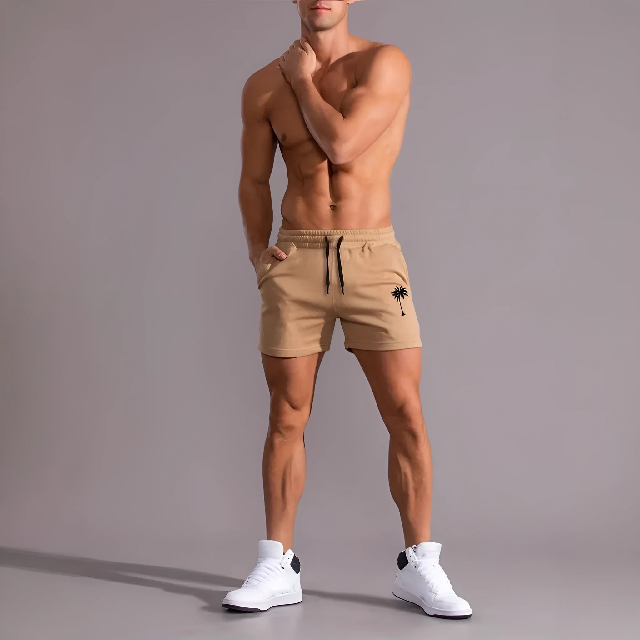 Khaki men's sports shorts with a white coconut leaf print, showing a straight leg and short length.