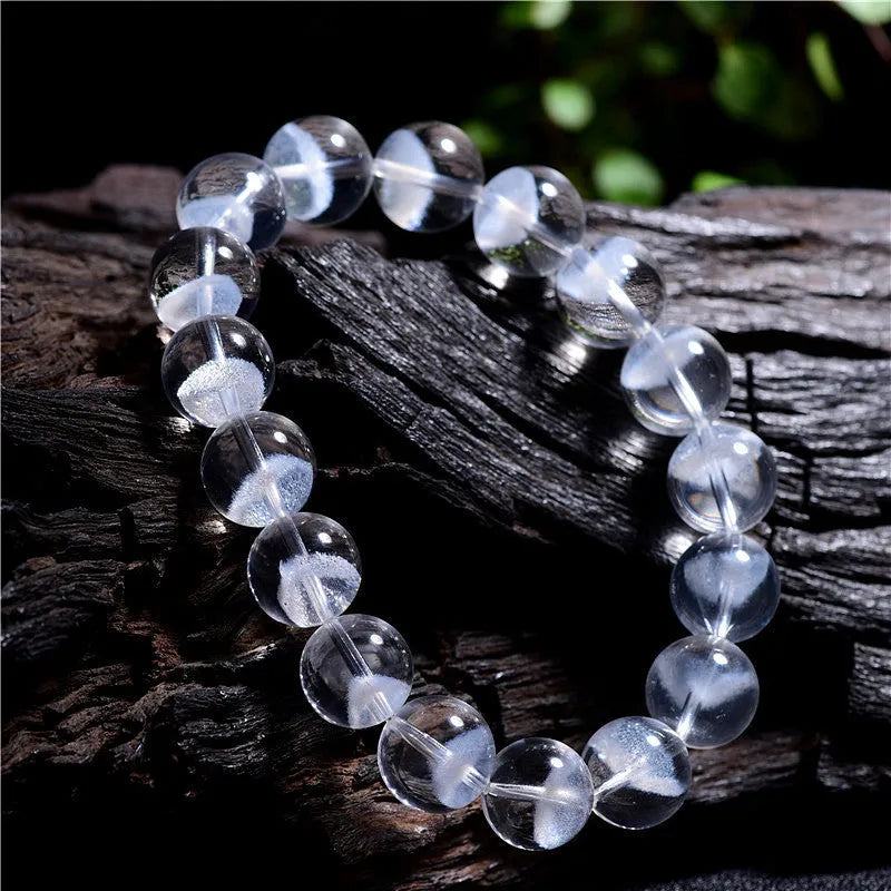 Women's white crystal pyramid bracelet with ghost detail and Ruyi design element