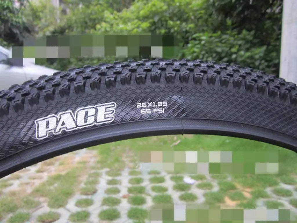 Ultralight puncture-resistant mountain bike tyre shown in black with white label option, for 26, 27.5 and 29-inch wheels.