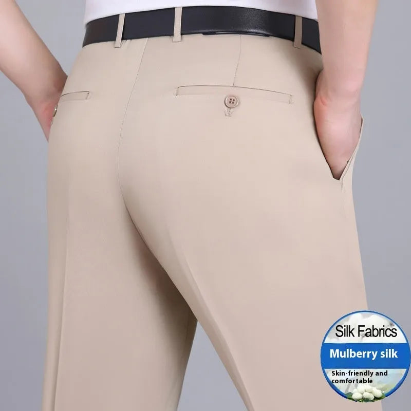Men's straight-leg mulberry silk blend business trousers in dark blue on a hanger.