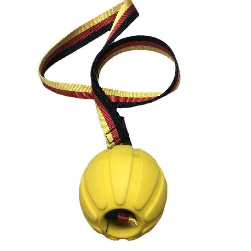 Floating EVA pet training ball in camouflage or yellow colours with attached string, shown in 6.5cm, 7cm, and 9cm diameter sizes