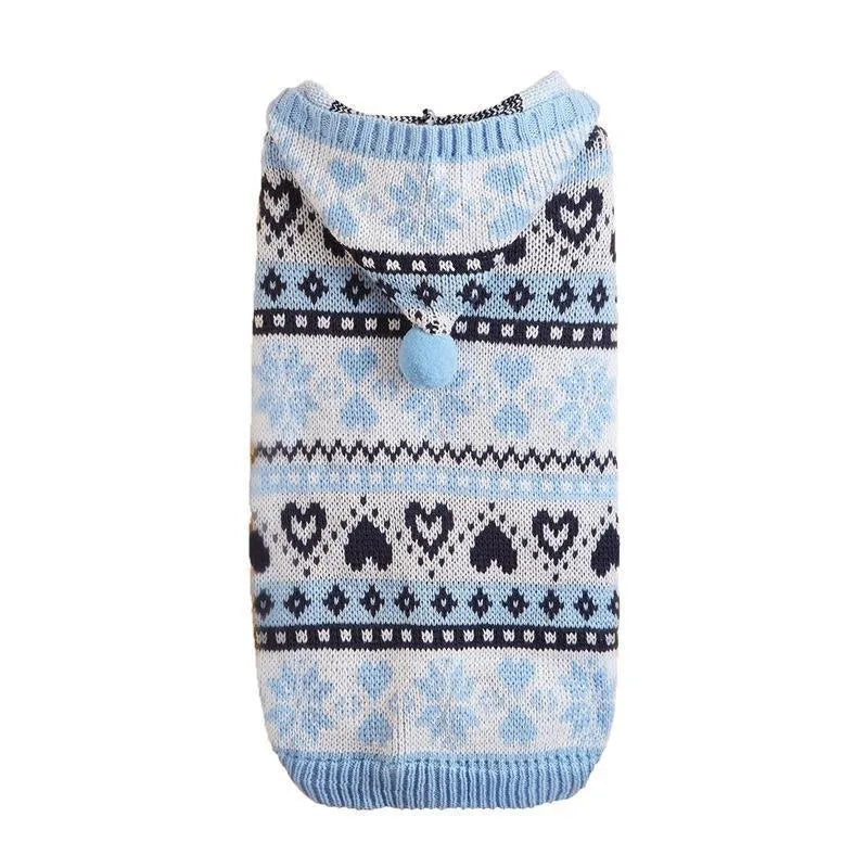 Pink striped camouflage dog sweater with snowflake and heart pattern on a small white dog.