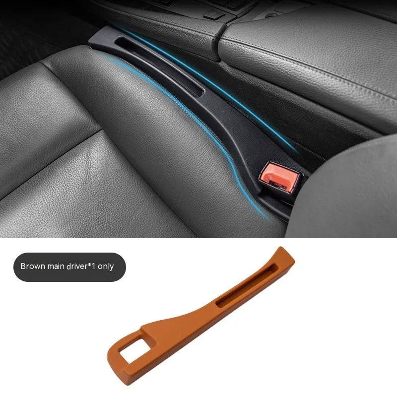 Black plastic car seat gap storage box with handle between vehicle seats
