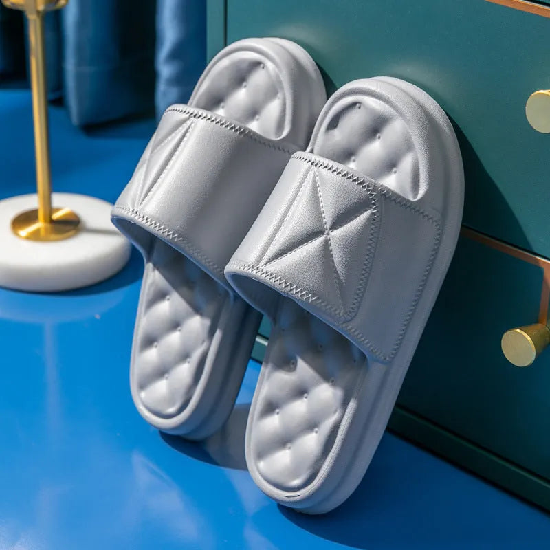 Pair of soft EVA bathroom slippers with a thick non-slip sole, shown in a choice of colours.