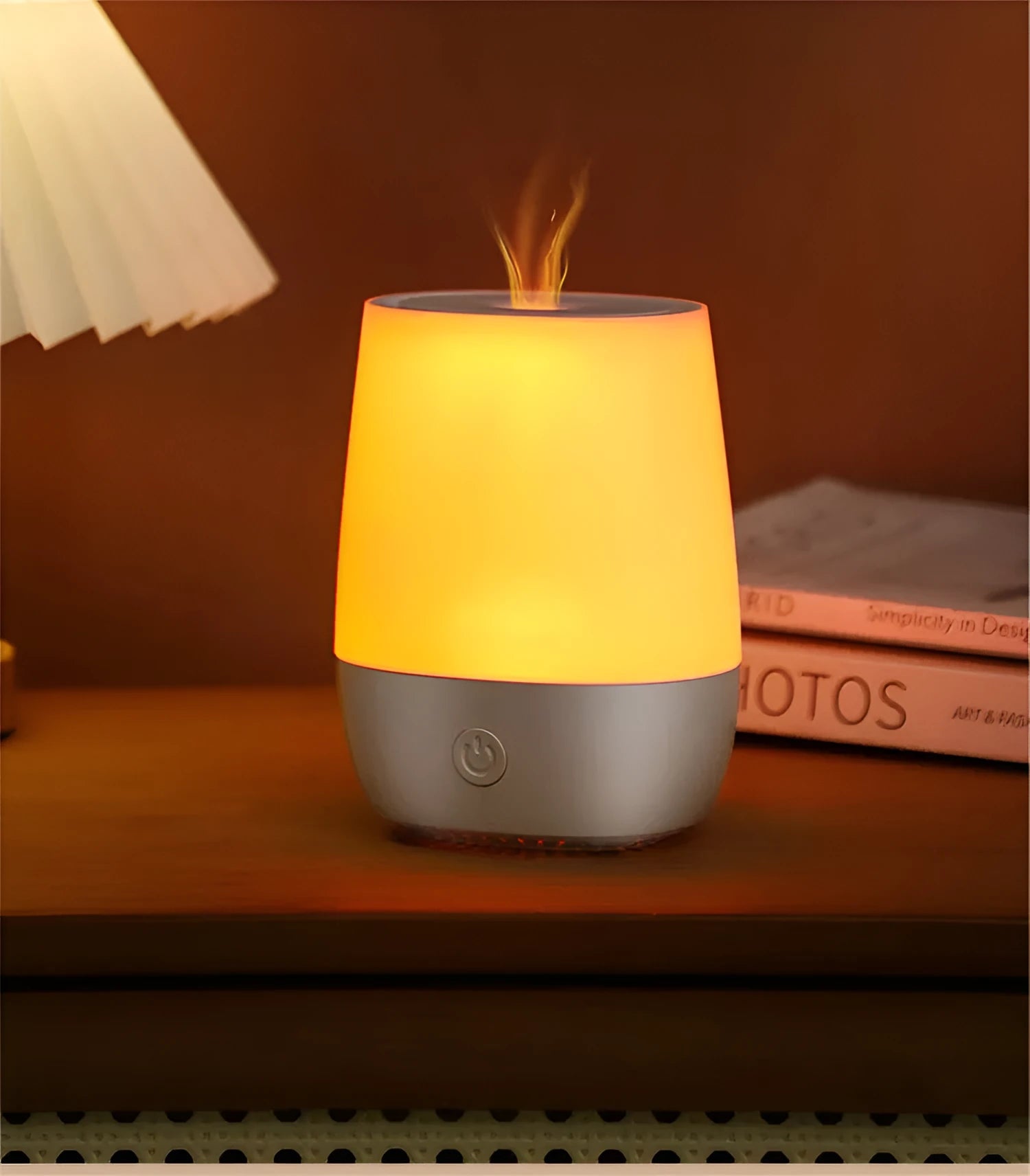 White USB aromatherapy diffuser with simulated flame effect showing mist output