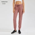 Women's high waist yoga pants with a drawstring waistband in a khaki colour.