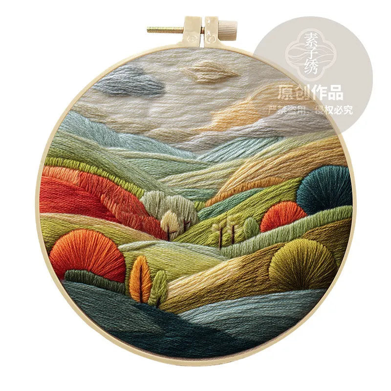 Embroidery DIY kit with landscape-printed cotton fabric, thread, needles, and a 15cm bamboo-style frame.