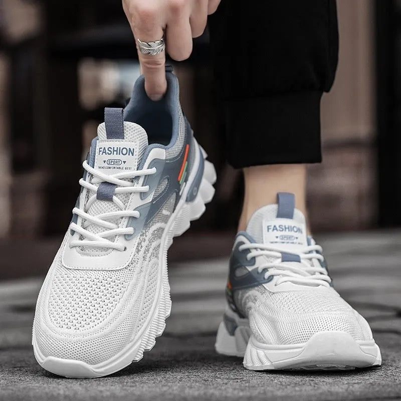 Men's white blue and black platform casual running shoes with cross straps and mesh upper.
