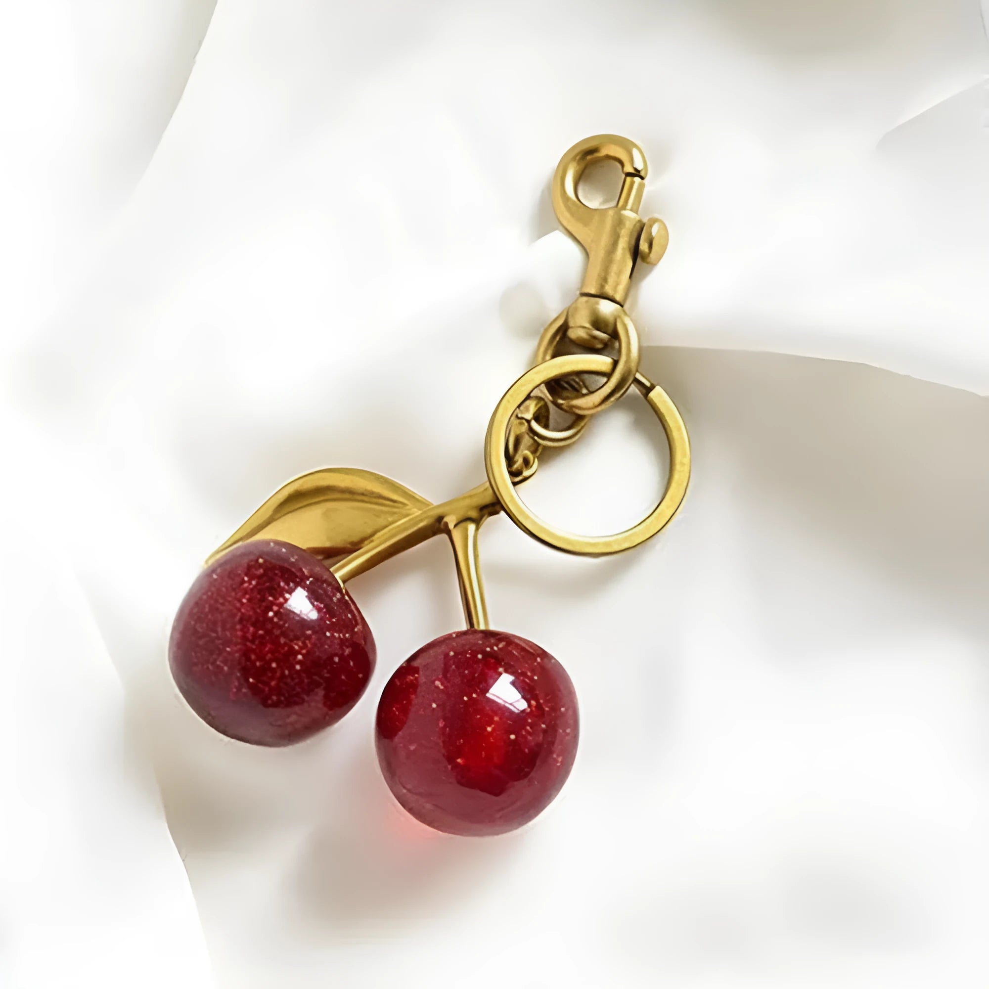 Red zinc alloy cherry pendant keychain with three-dimensional design