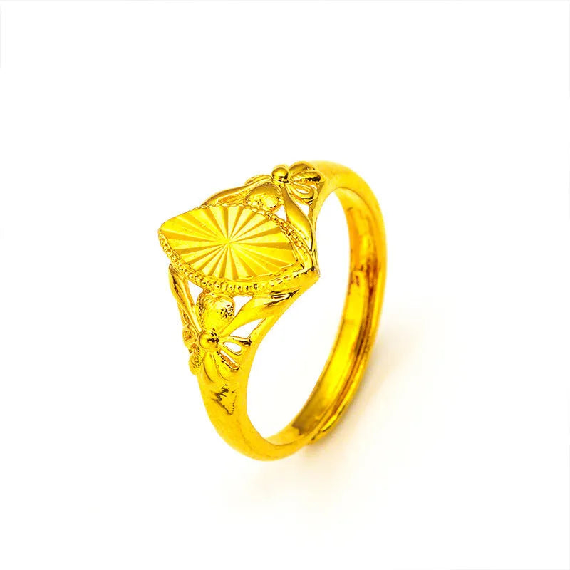 Gold colour brass ring with geometric open diamond flower design and textured details